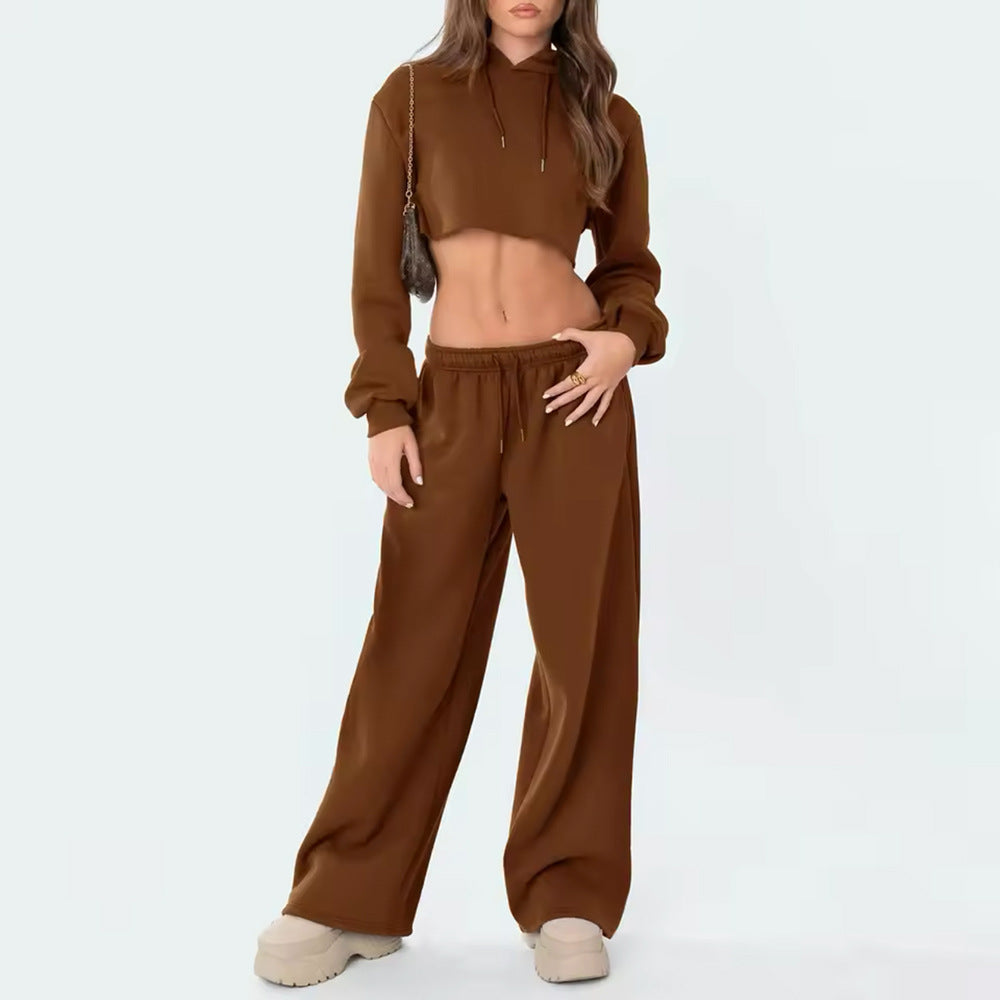 Woman wearing a brown tracksuit on a white background
